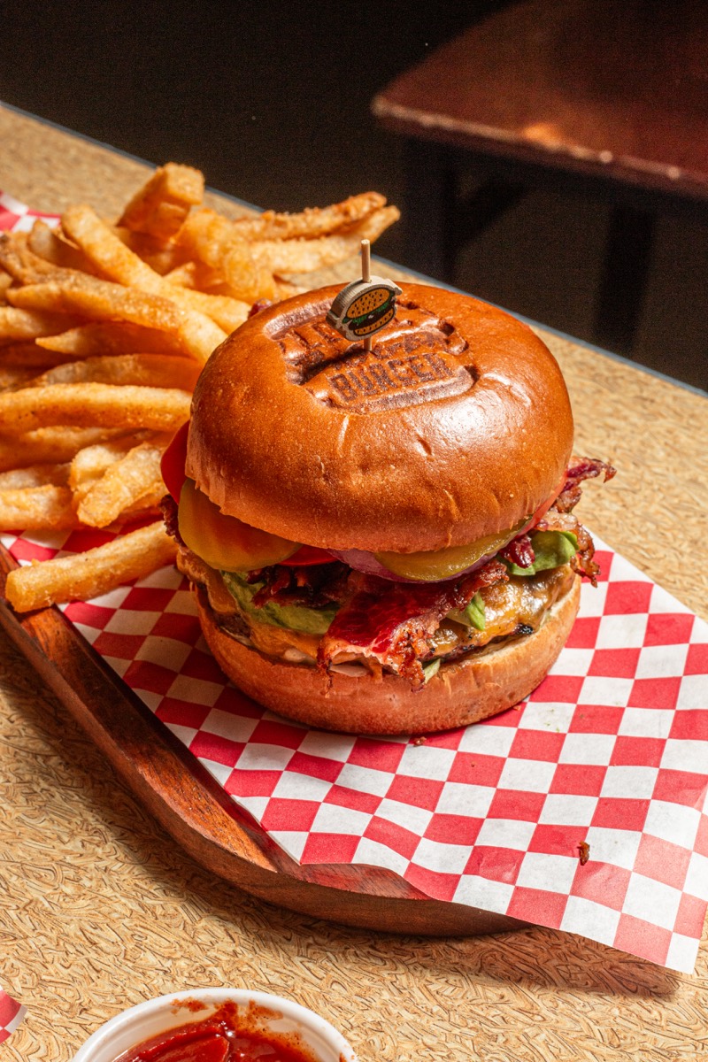 Restaurant burger and fries served on red checker paper