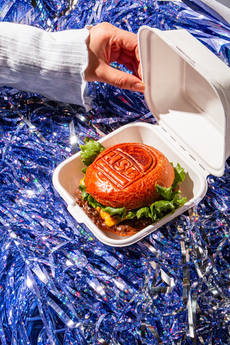 Branded smash burger revealed inside a takeout box